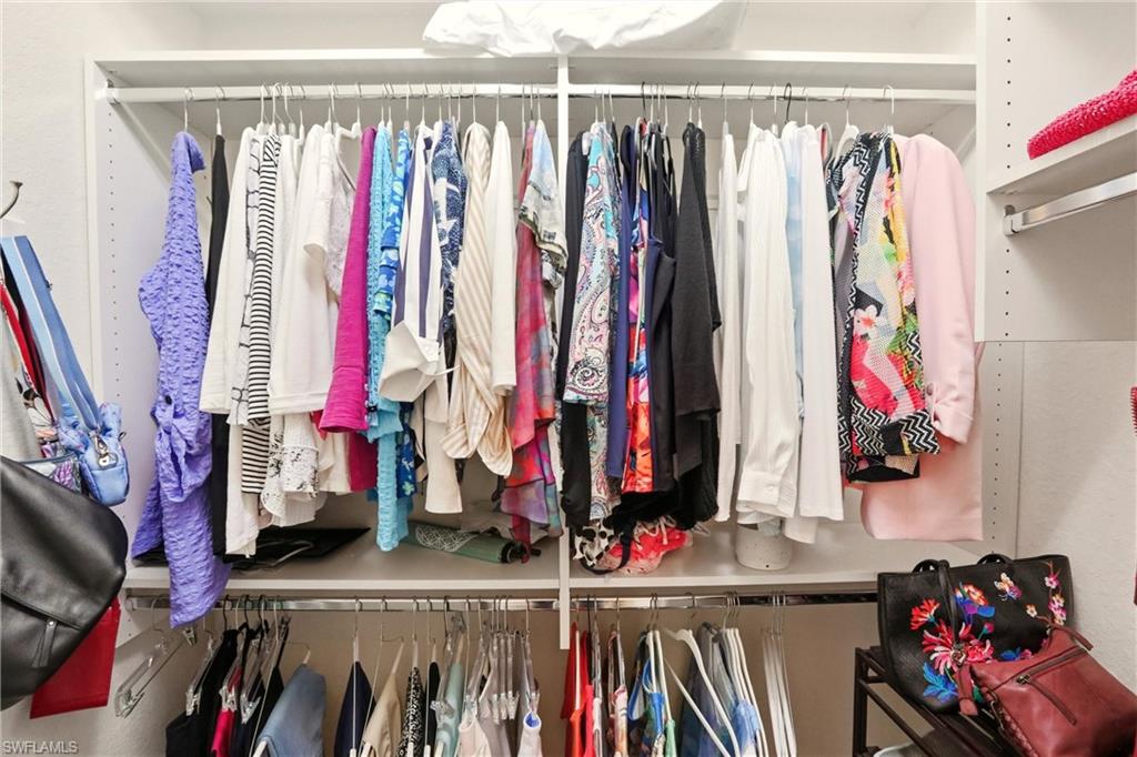 20441 Rookery Drive Estero, FL 33928 - Photo 20 of 41 a view of walk in closet with clothes