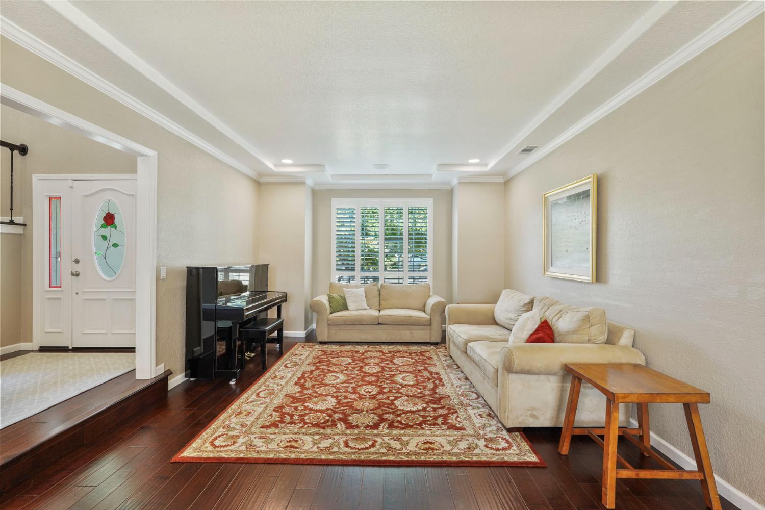 18432 Ironstone Street Woodbridge, CA 95258 - Photo 8 of 50 The formal living room with natural light, gorgeous wood floors, and detailed ceiling.