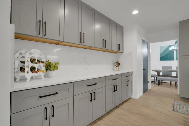 a kitchen with cabinets and window