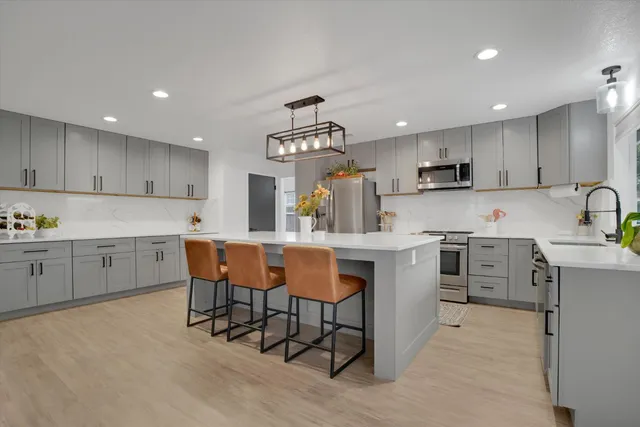 a kitchen with counter top space cabinets and stainless steel appliances