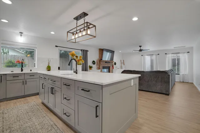 a kitchen with center island and stainless steel appliances