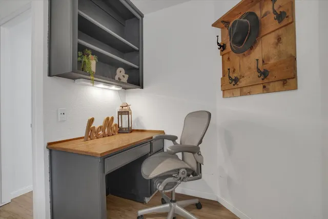 a dining room with table and chairs