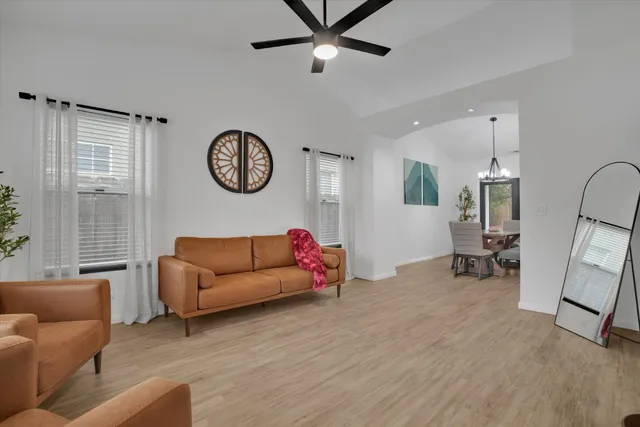 a living room with furniture and a table