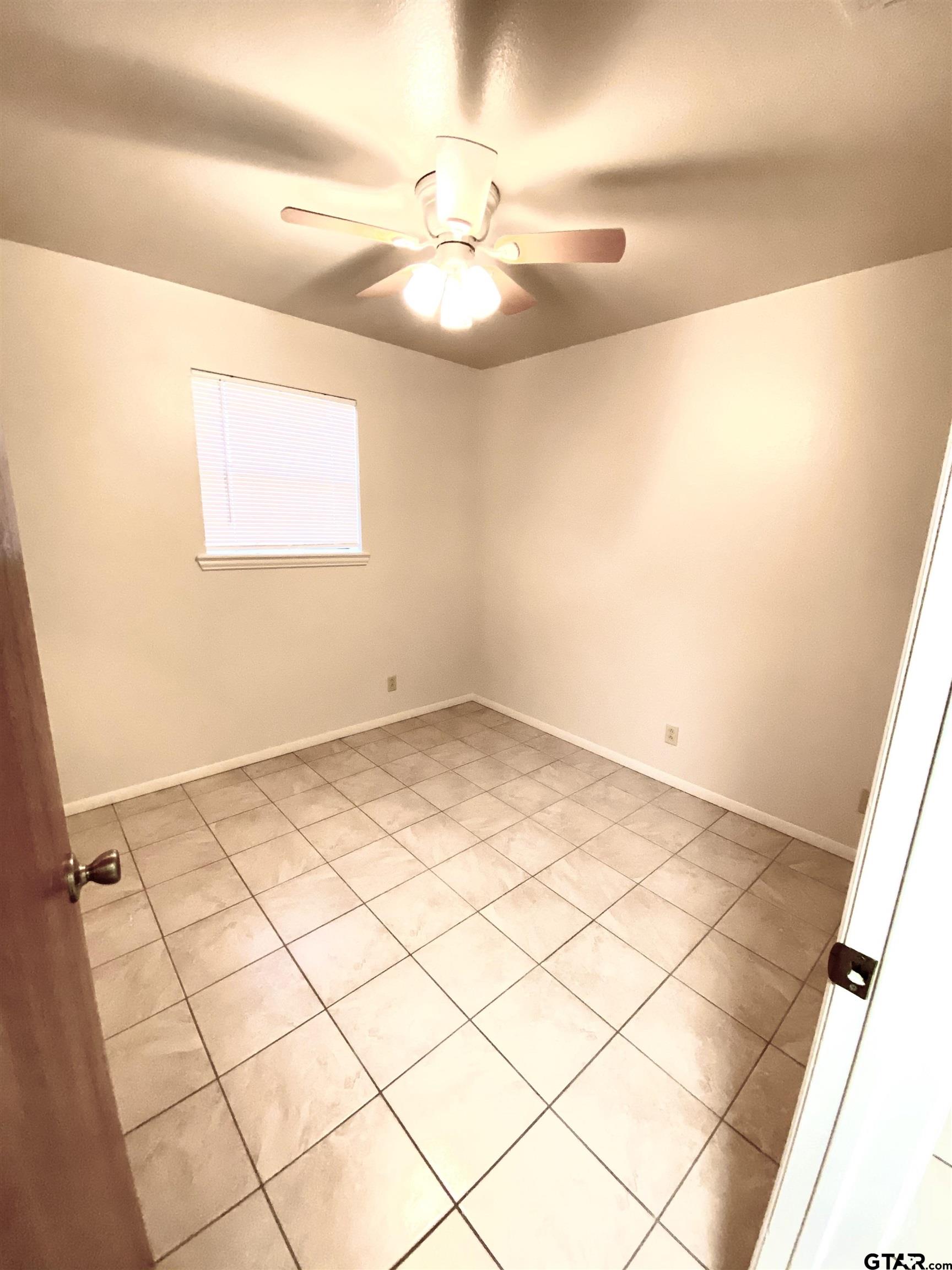 9650 Front Street Murchison, TX 75778 - Photo 11 of 11 a view of a room with a window and ceiling fan