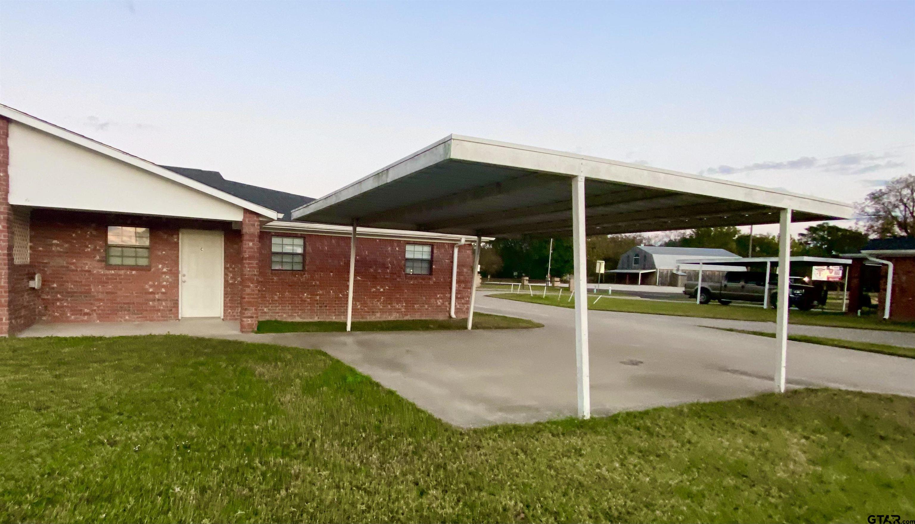 9650 Front Street Murchison, TX 75778 - Photo 2 of 11 a view of a house with a yard and porch
