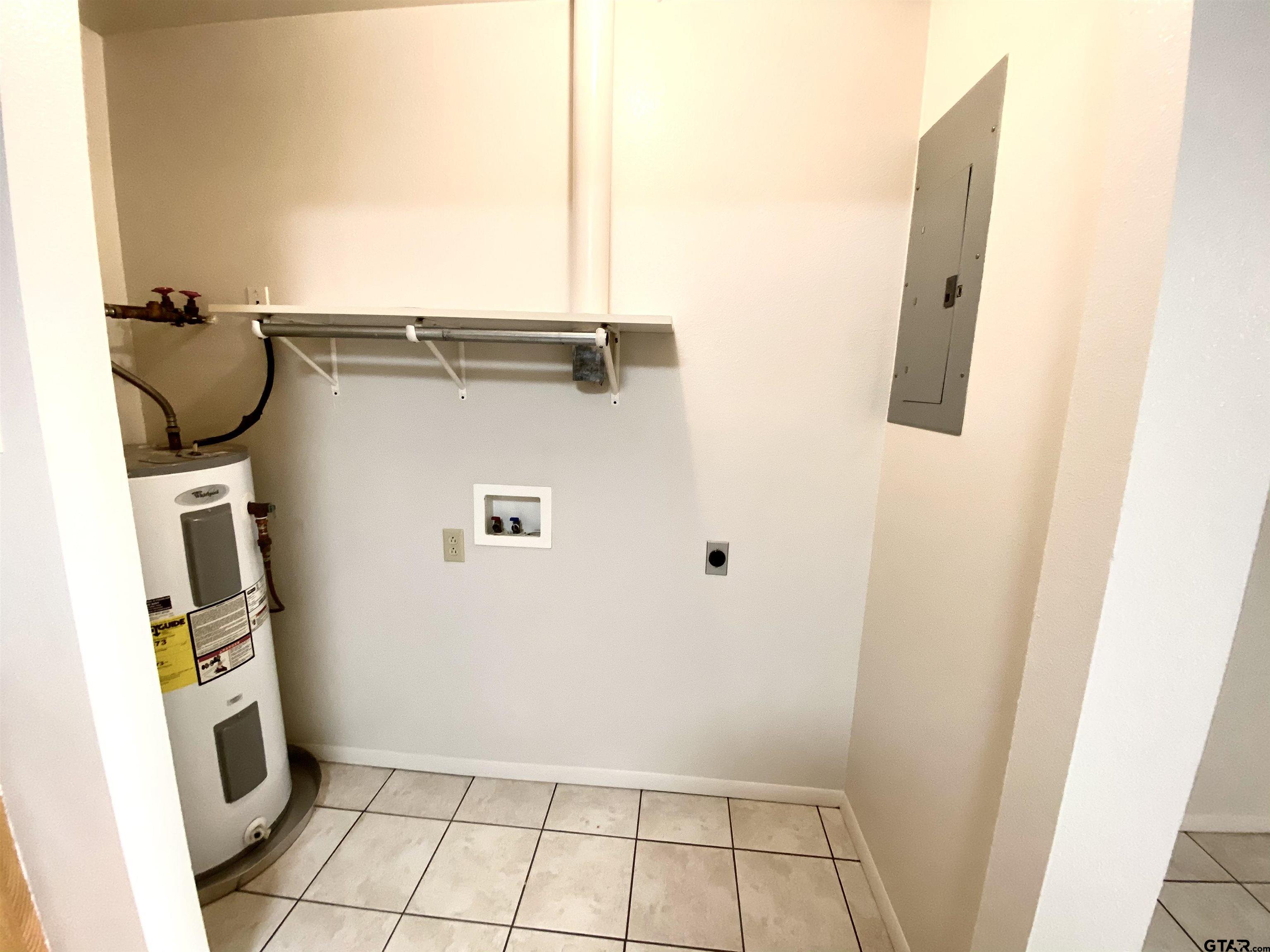 9650 Front Street Murchison, TX 75778 - Photo 5 of 11 a view of storage and utility room with washer and dryer