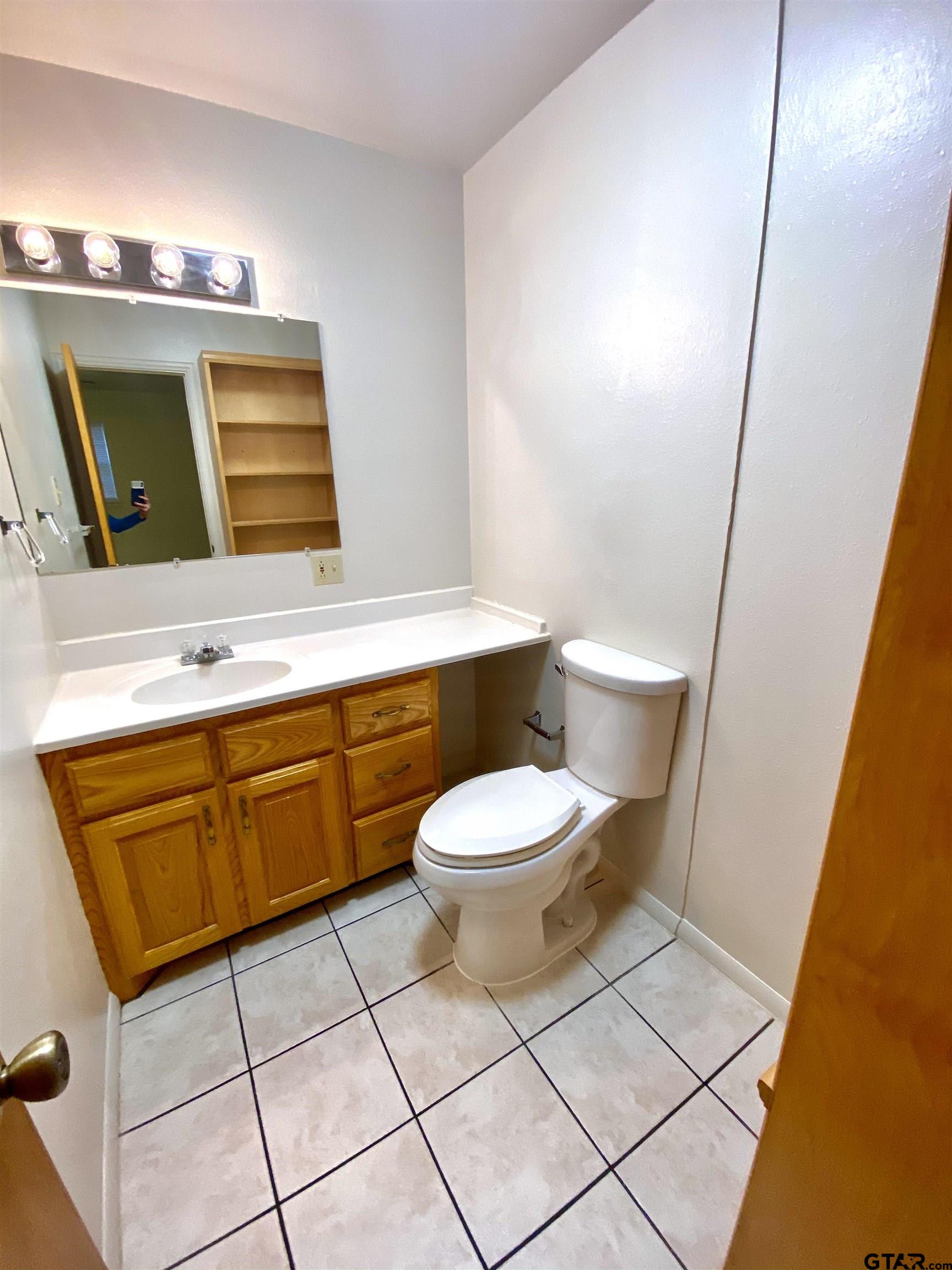 9650 Front Street Murchison, TX 75778 - Photo 9 of 11 a bathroom with a toilet sink and mirror