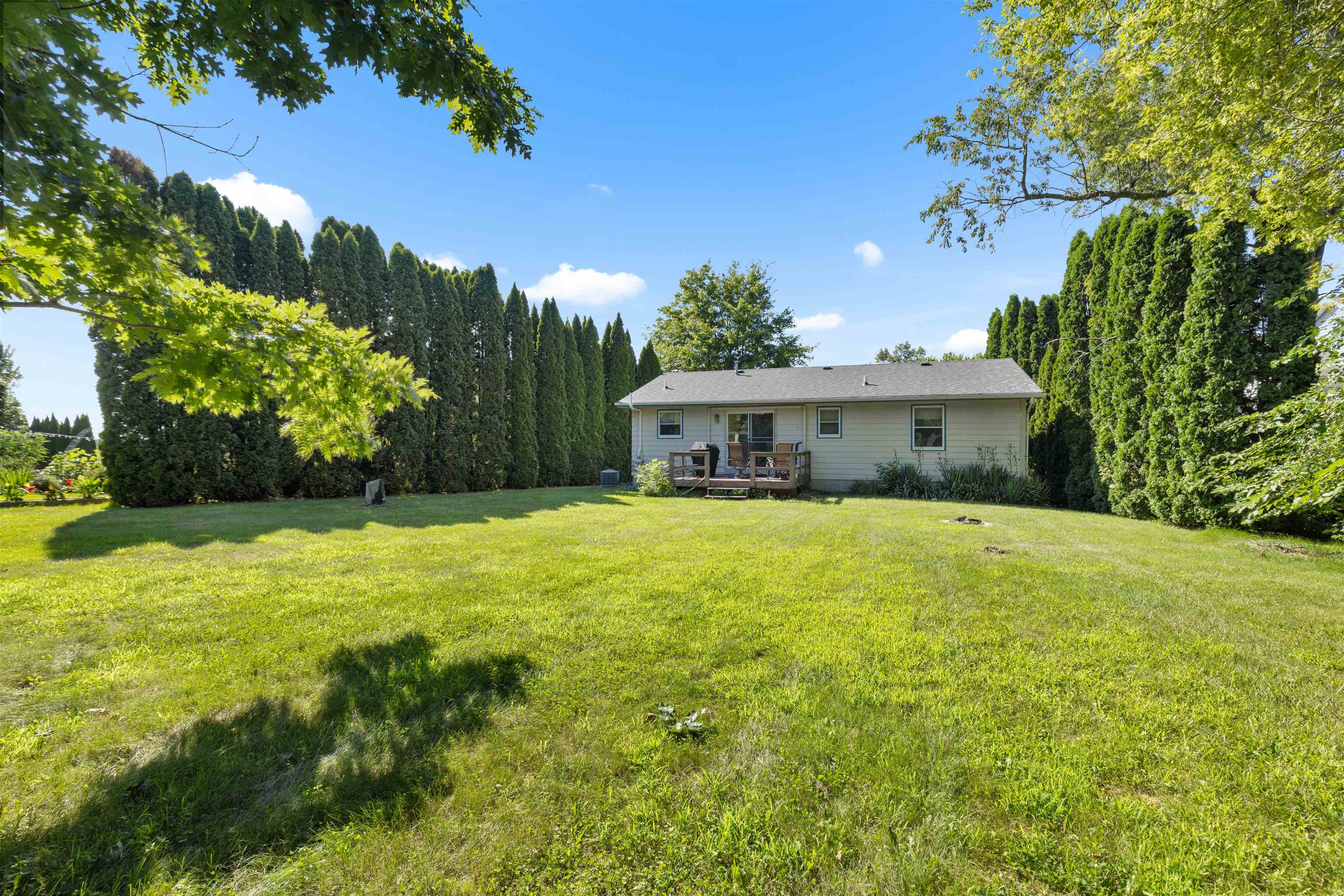 104 Deerpath Way Southwest Poplar Grove, IL 61065 - Photo 13 of 16 a front view of a house with yard and green space