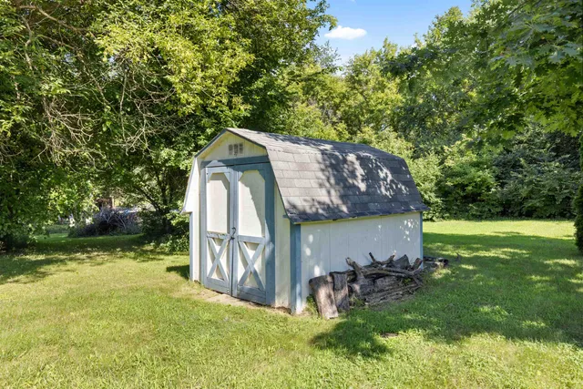 a view of backyard with a garden and entertaining space