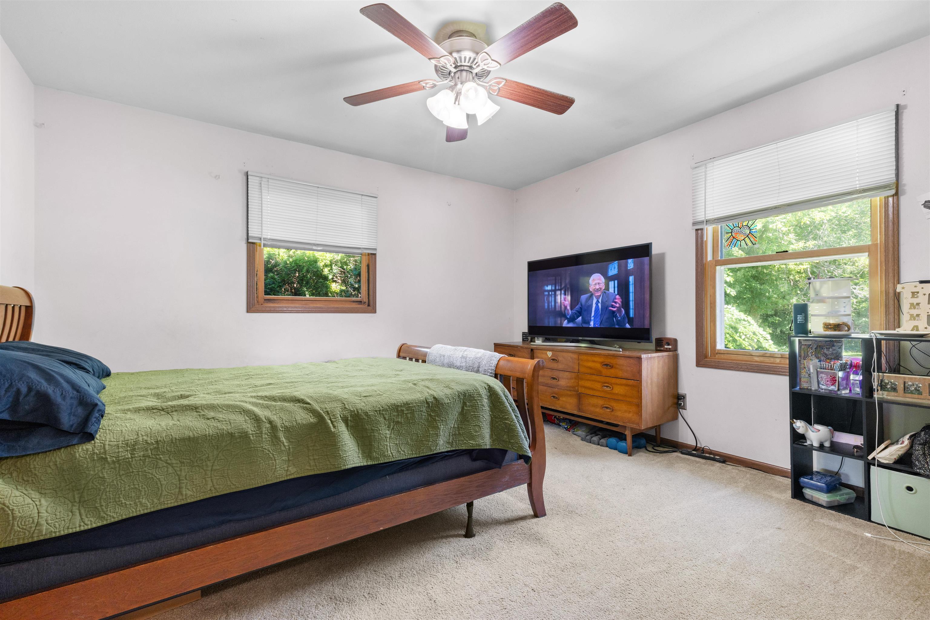 104 Deerpath Way Southwest Poplar Grove, IL 61065 - Photo 6 of 16 a bedroom with a bed and a chandelier