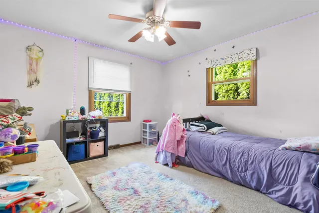 a bedroom with a bed and a couch