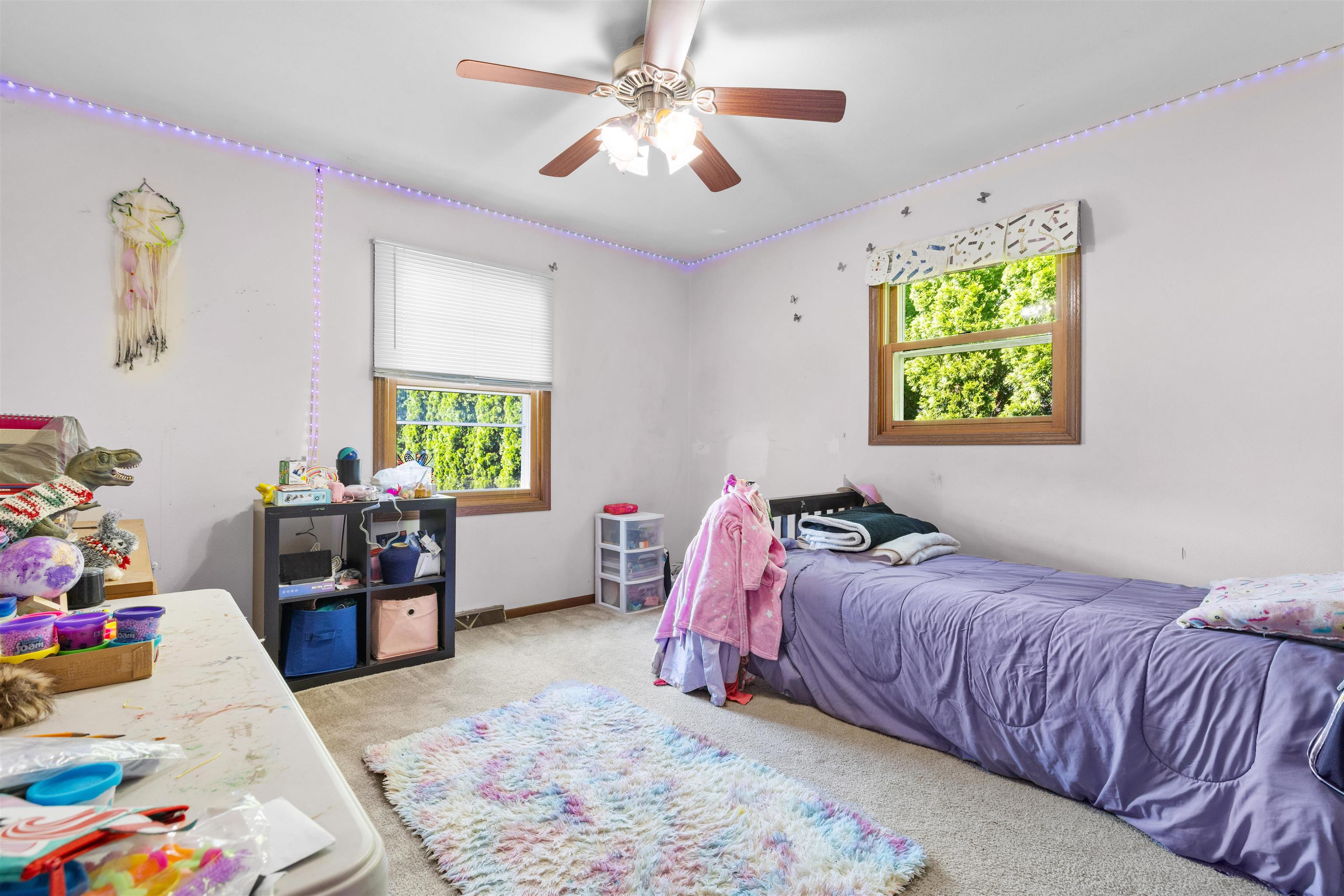 104 Deerpath Way Southwest Poplar Grove, IL 61065 - Photo 7 of 16 a bedroom with a bed and a couch