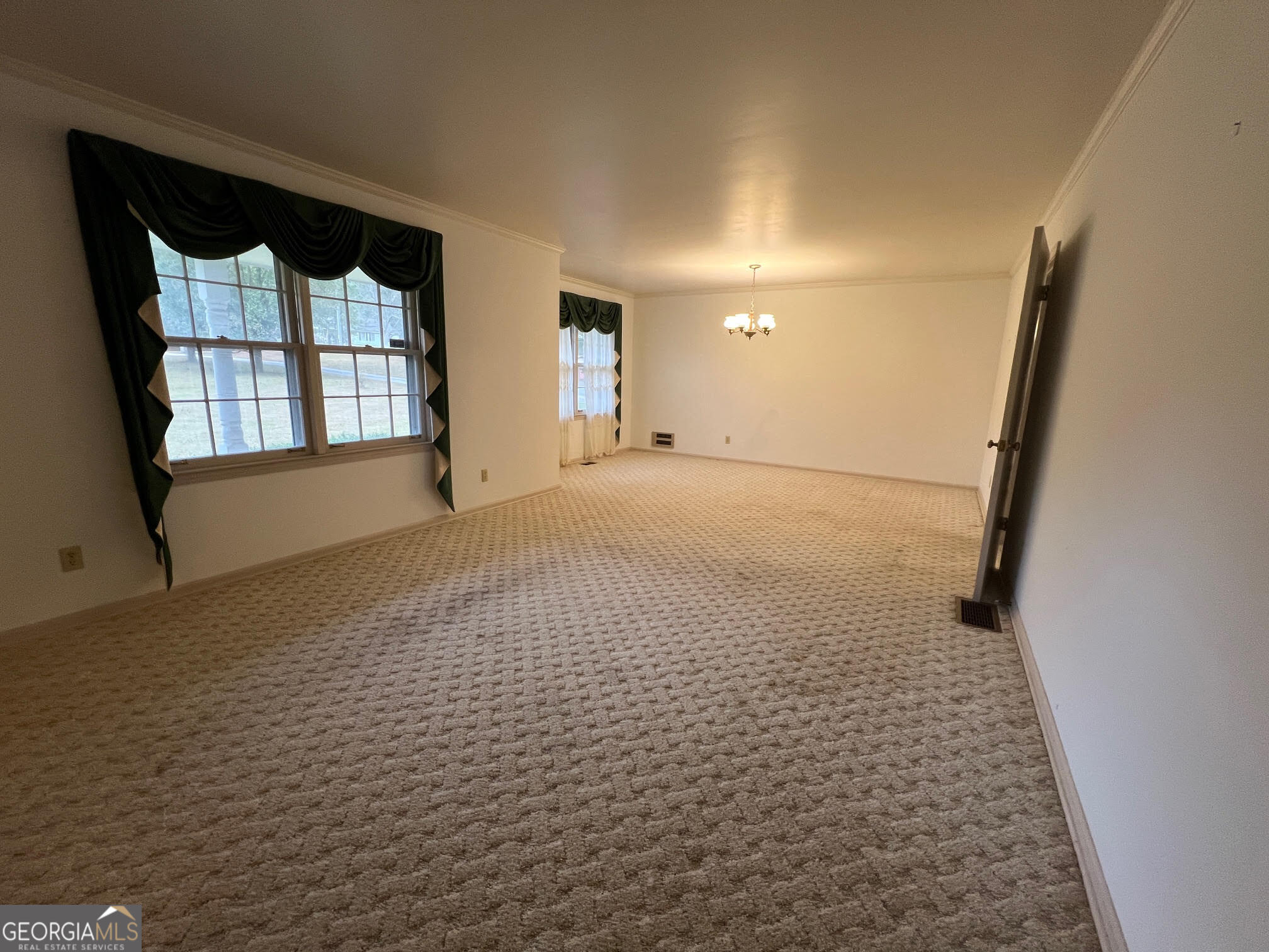 215 Old Oxford Road Covington, GA 30014 - Photo 16 of 19 a view of empty room with windows
