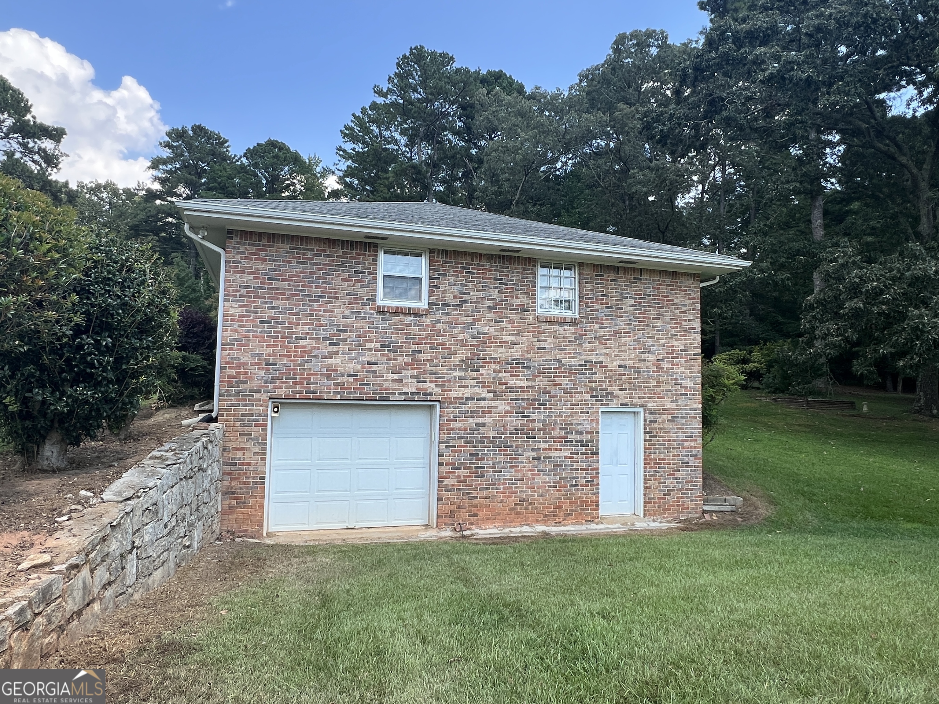 215 Old Oxford Road Covington, GA 30014 - Photo 2 of 19 a brick house with a yard
