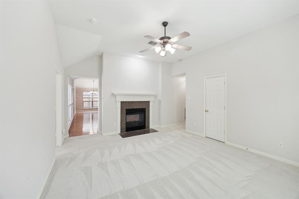 409 Fox Trail Allen, TX 75002 - Photo 22 of 31 a view of an empty room with a fireplace