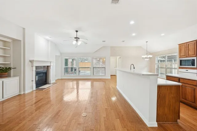 a view of kitchen with cabinets and wooden floor