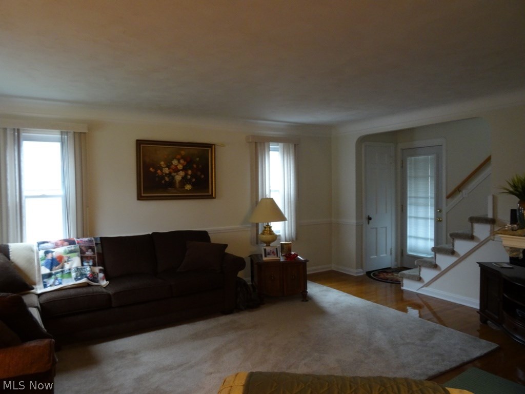 4767 Broadale Road Cleveland, OH 44109 - Photo 5 of 19 Elegant living room with open stair. Rear door leads to pleasant brick patio.