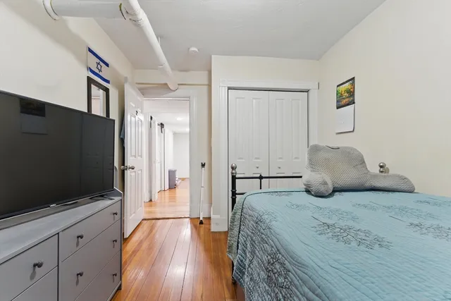 a bedroom with a bed and furniture