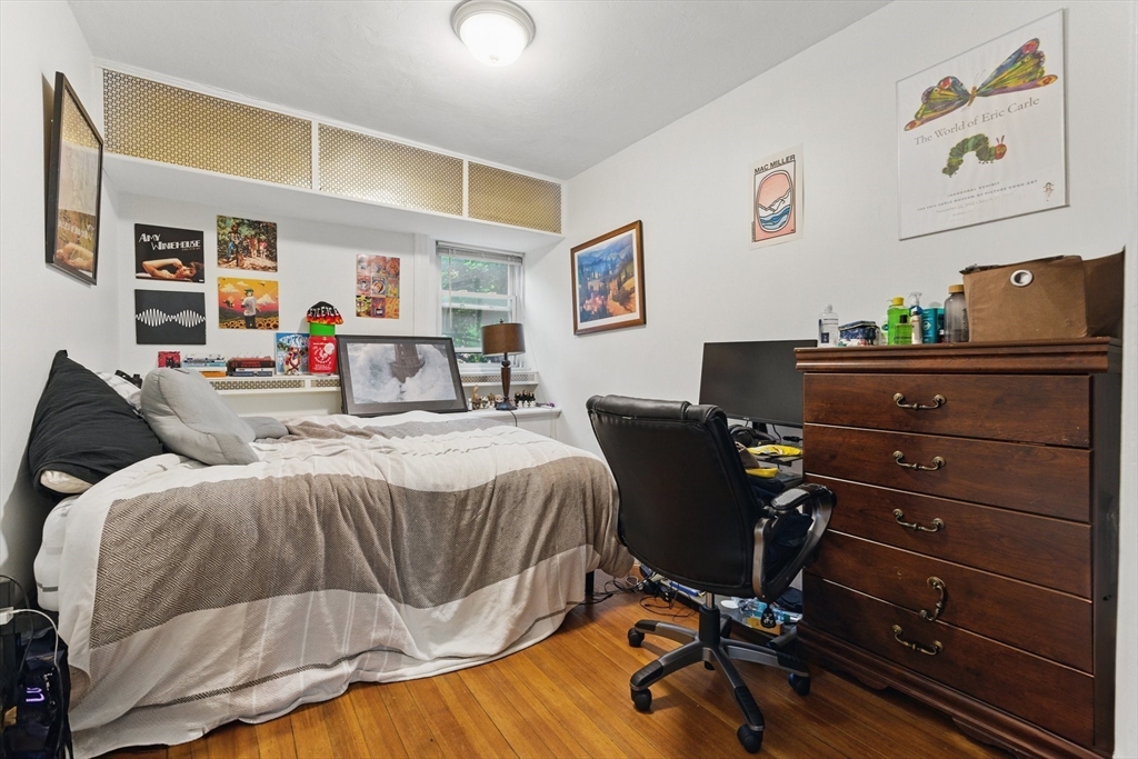 16 Garrison Road, Unit 7 Brookline, MA 02445 - Photo 20 of 33 a bedroom with a bed and furniture