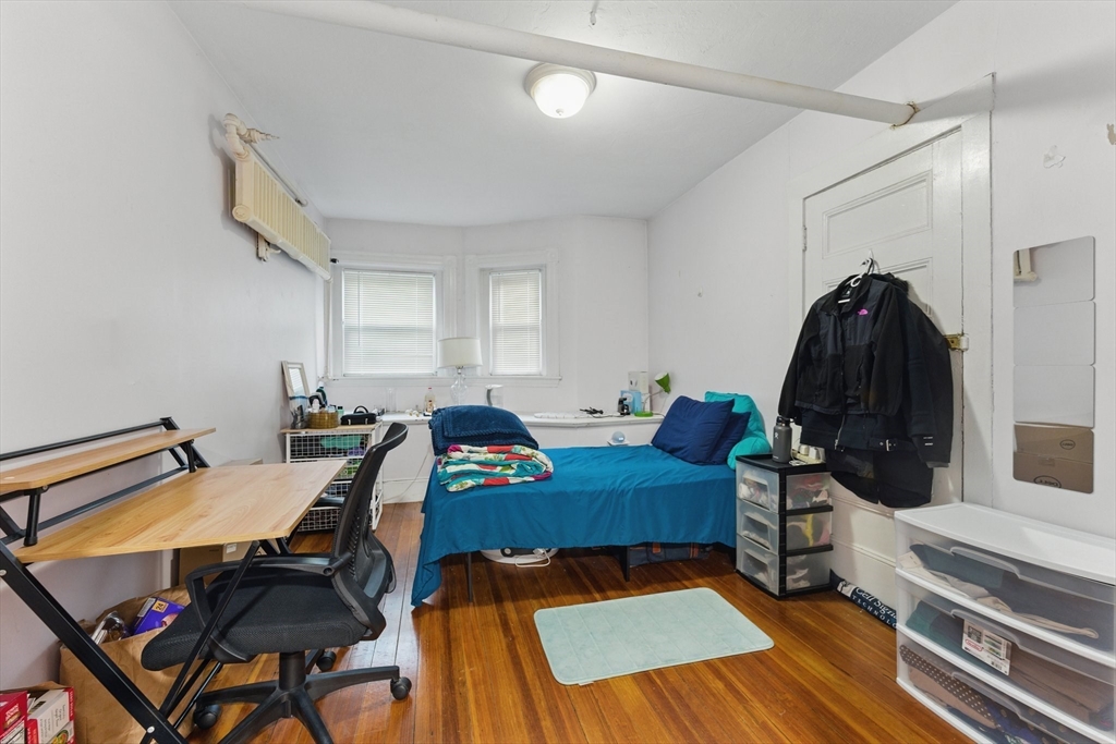 16 Garrison Road, Unit 7 Brookline, MA 02445 - Photo 23 of 33 a living room with furniture and wooden floor