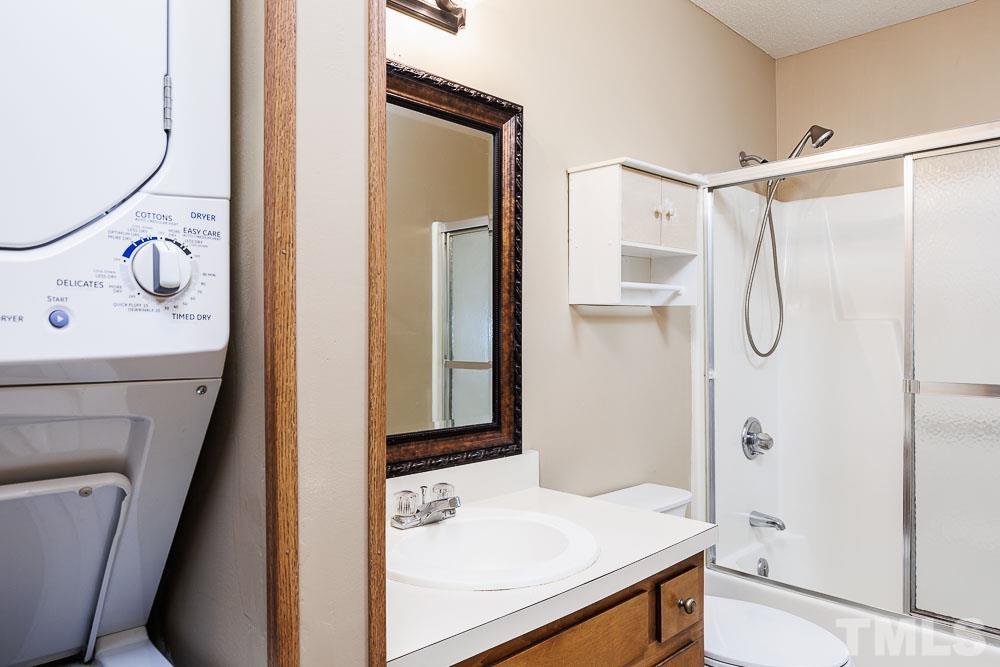 3249 Mill Run, Unit 190 Raleigh, NC 27612 - Photo 18 of 23 Note the stackable washer and dyer in this bathroom that conveys.