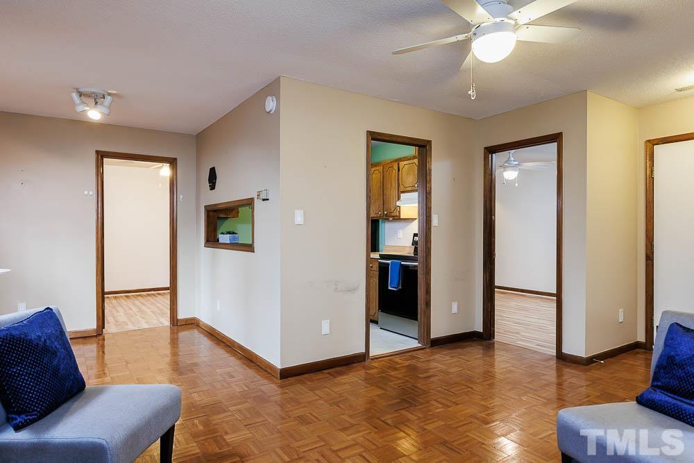 3249 Mill Run, Unit 190 Raleigh, NC 27612 - Photo 8 of 23 Alternate view of the kitchen and bedrooms from the family room.