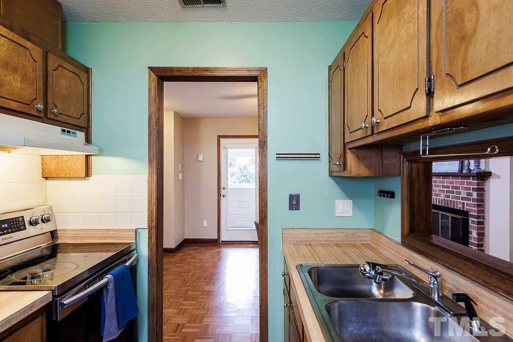 3249 Mill Run, Unit 190 Raleigh, NC 27612 - Photo 9 of 23 Newer range. Includes dishwasher and large sink. Plenty of cabinets for storage!