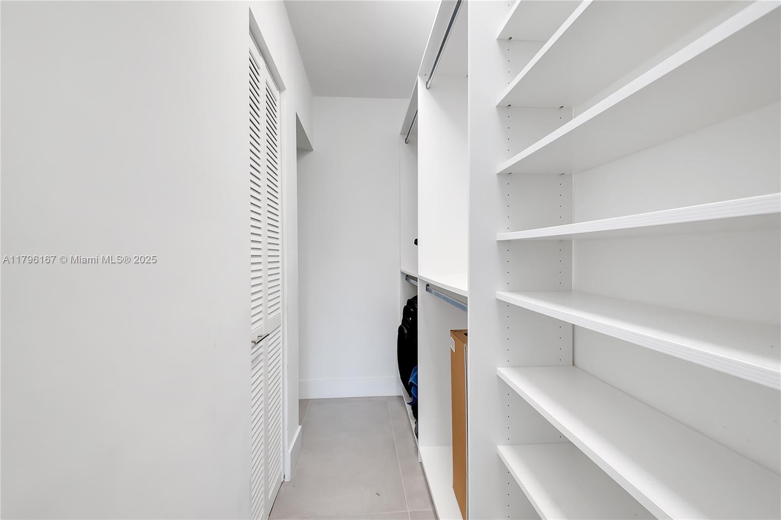 240 Galen Drive, Unit 308 Key Biscayne, FL 33149 - Photo 9 of 22 Master bedroom custom closet