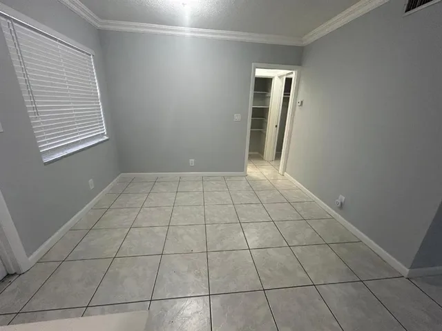 an empty room with a bathroom