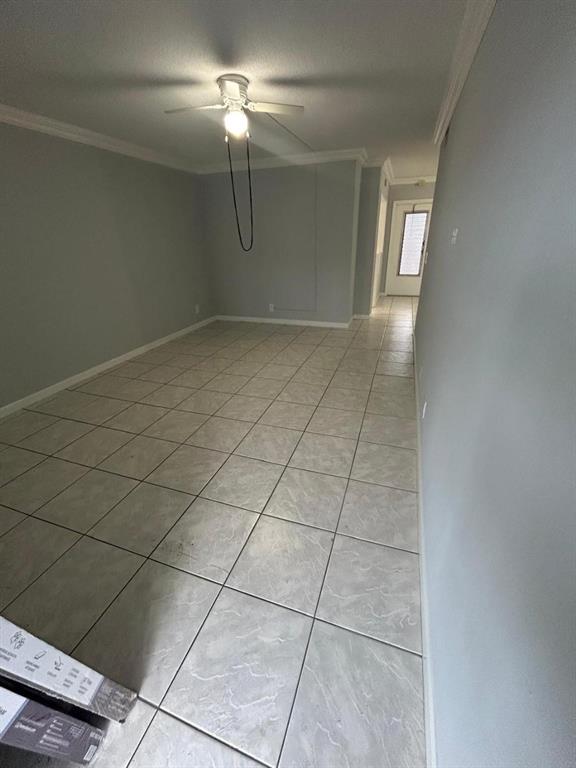 1310 Northwest 43rd Avenue, Unit 303 Lauderhill, FL 33313 - Photo 3 of 15 a view of a livingroom with a chandelier fan and glass door