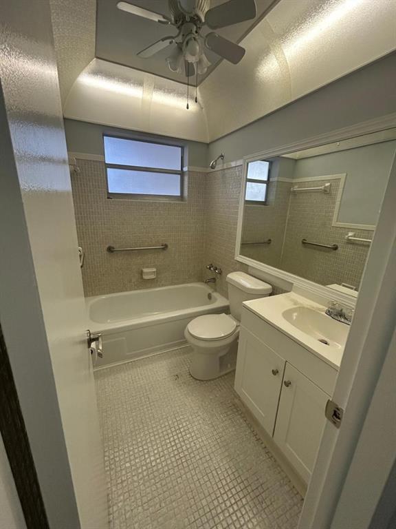 1310 Northwest 43rd Avenue, Unit 303 Lauderhill, FL 33313 - Photo 7 of 15 a bathroom with a sink a toilet and shower