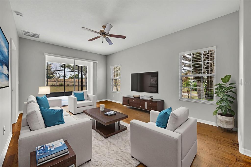 3201 Sonesta Court, Unit A Clermont, FL 34711 - Photo 15 of 34 a living room with furniture and a flat screen tv
