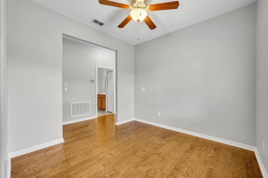 3201 Sonesta Court, Unit A Clermont, FL 34711 - Photo 20 of 34 a view of empty room with wooden floor