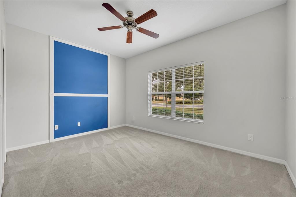 3201 Sonesta Court, Unit A Clermont, FL 34711 - Photo 26 of 34 an empty room with windows and fan