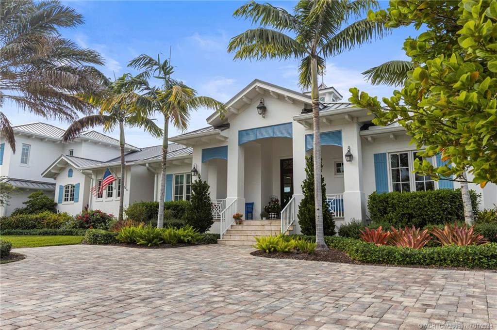 3 Island Road Stuart, FL 34996 - Photo 2 of 58 a front view of a house with a garden