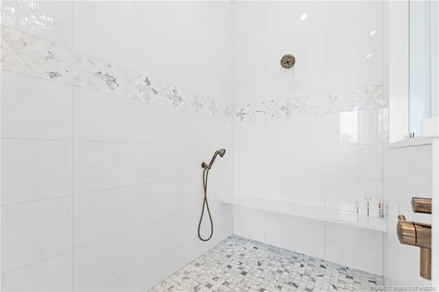 a living room with furniture chess board and a large window