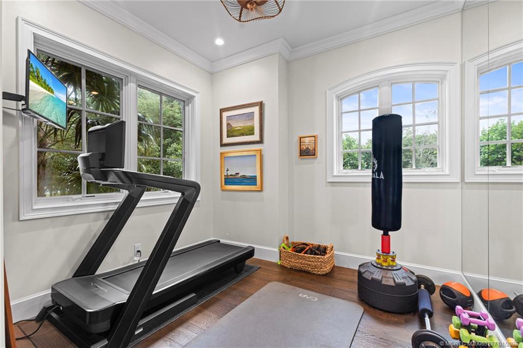 3 Island Road Stuart, FL 34996 - Photo 31 of 58 a living room with furniture and a window