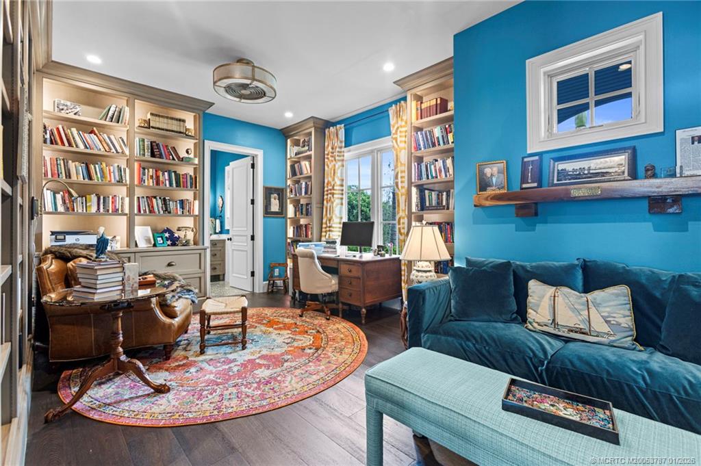 3 Island Road Stuart, FL 34996 - Photo 32 of 58 a living room with furniture chess board and a large window