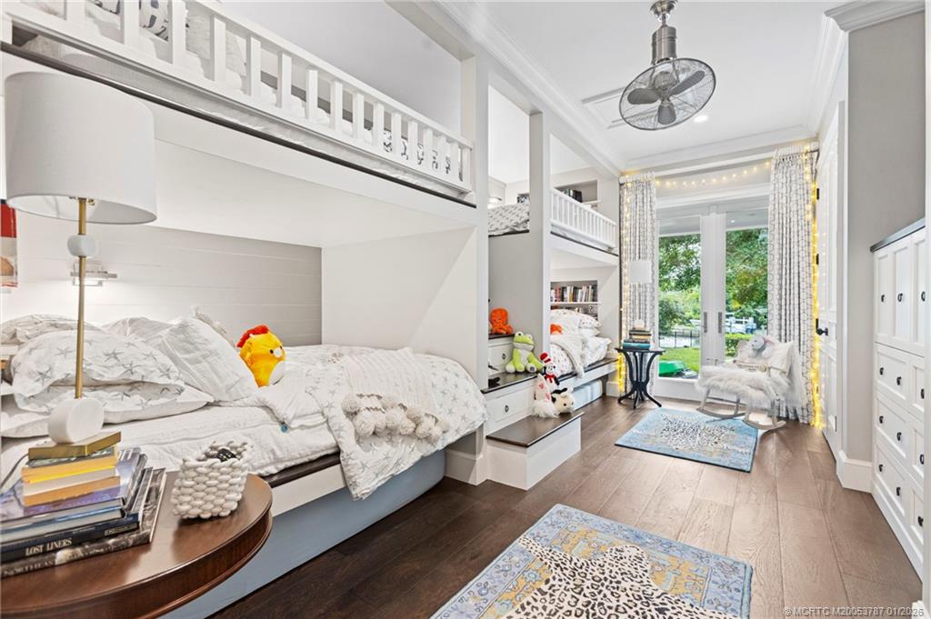 3 Island Road Stuart, FL 34996 - Photo 34 of 58 a bedroom with furniture and a window