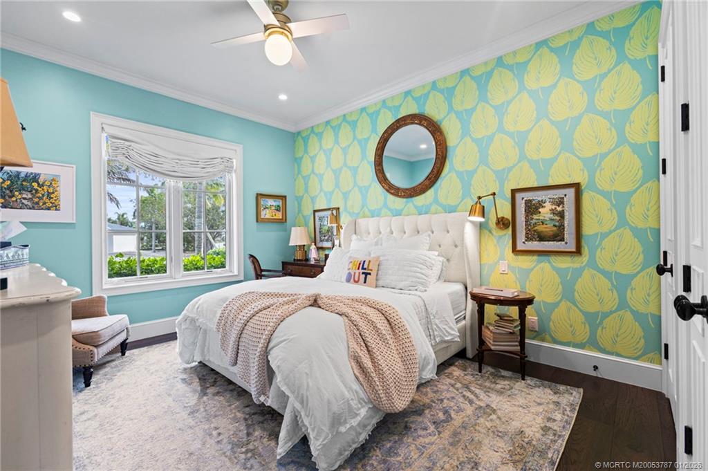 3 Island Road Stuart, FL 34996 - Photo 38 of 58 a bedroom with a bed lamp closet and large window