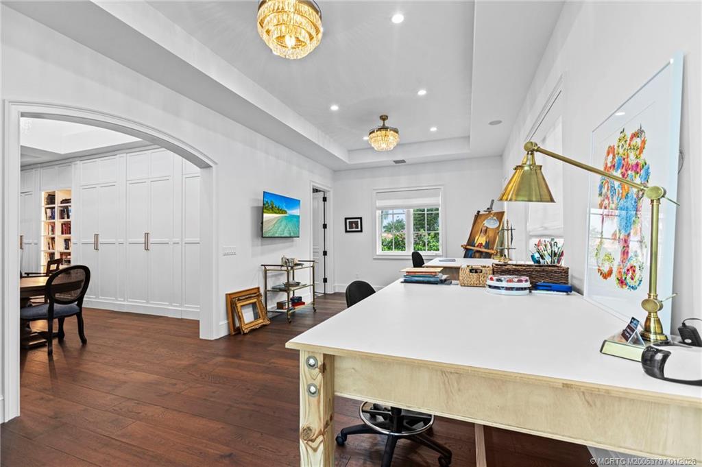 3 Island Road Stuart, FL 34996 - Photo 44 of 58 a view of a dining room with furniture and a wooden floor