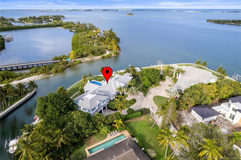 3 Island Road Sewall's Point, FL 34996 - Photo 5 of 59 an aerial view of a house a yard and a lake view
