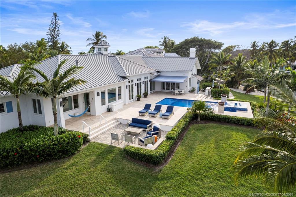 3 Island Road Stuart, FL 34996 - Photo 53 of 58 a aerial view of a house with swimming pool and lake view
