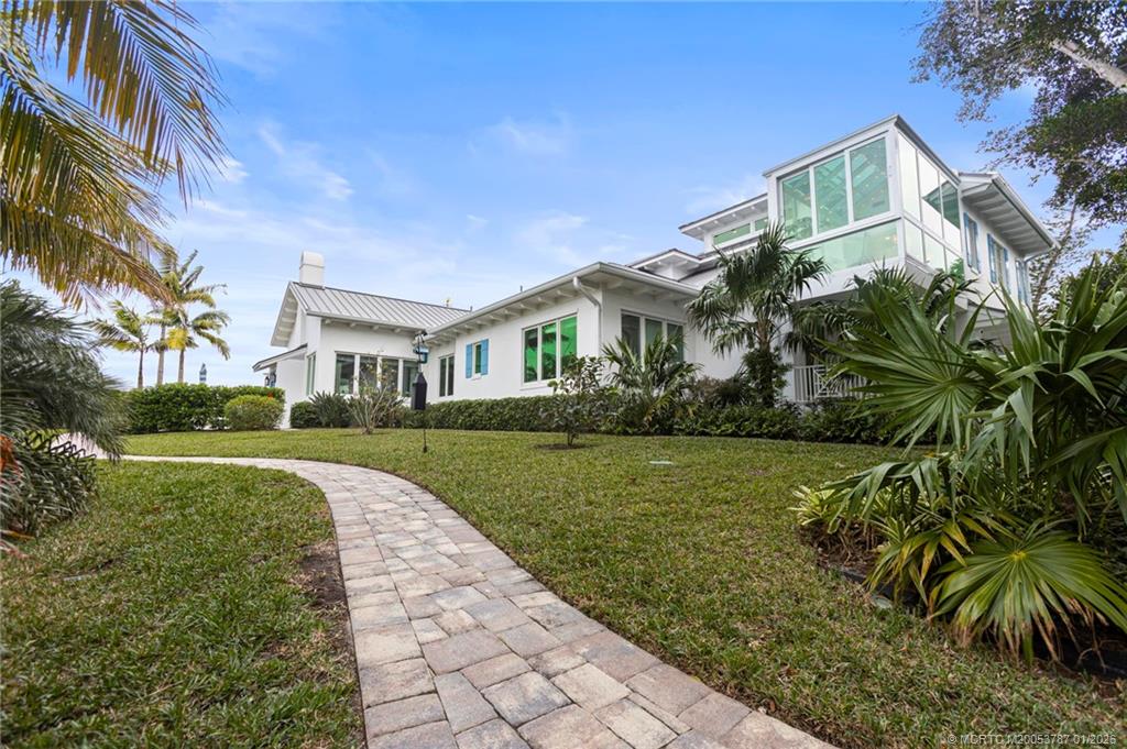 3 Island Road Stuart, FL 34996 - Photo 55 of 58 a front view of a house with a yard