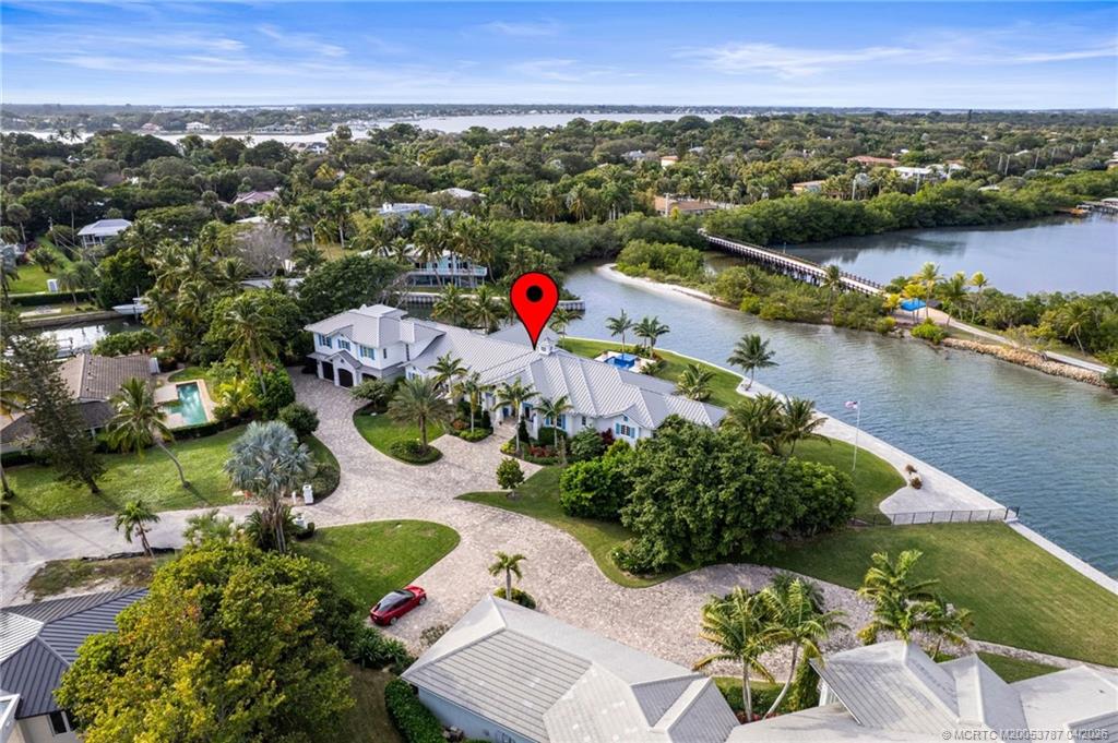 3 Island Road Sewall's Point, FL 34996 - Photo 6 of 59 an aerial view of lake and residential houses with outdoor space