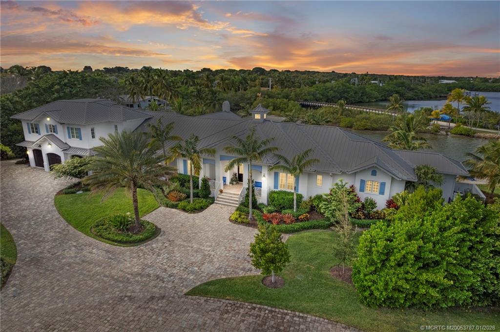 3 Island Road Stuart, FL 34996 - Photo 8 of 58 a view of a garden with a house