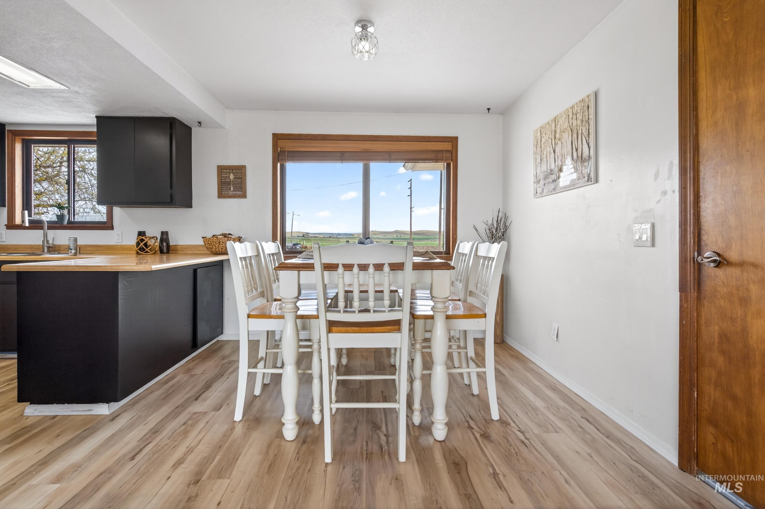 8989 Hillview Road Emmett, ID 83617 - Photo 12 of 50 Dining space featuring light wood finished floors and baseboards