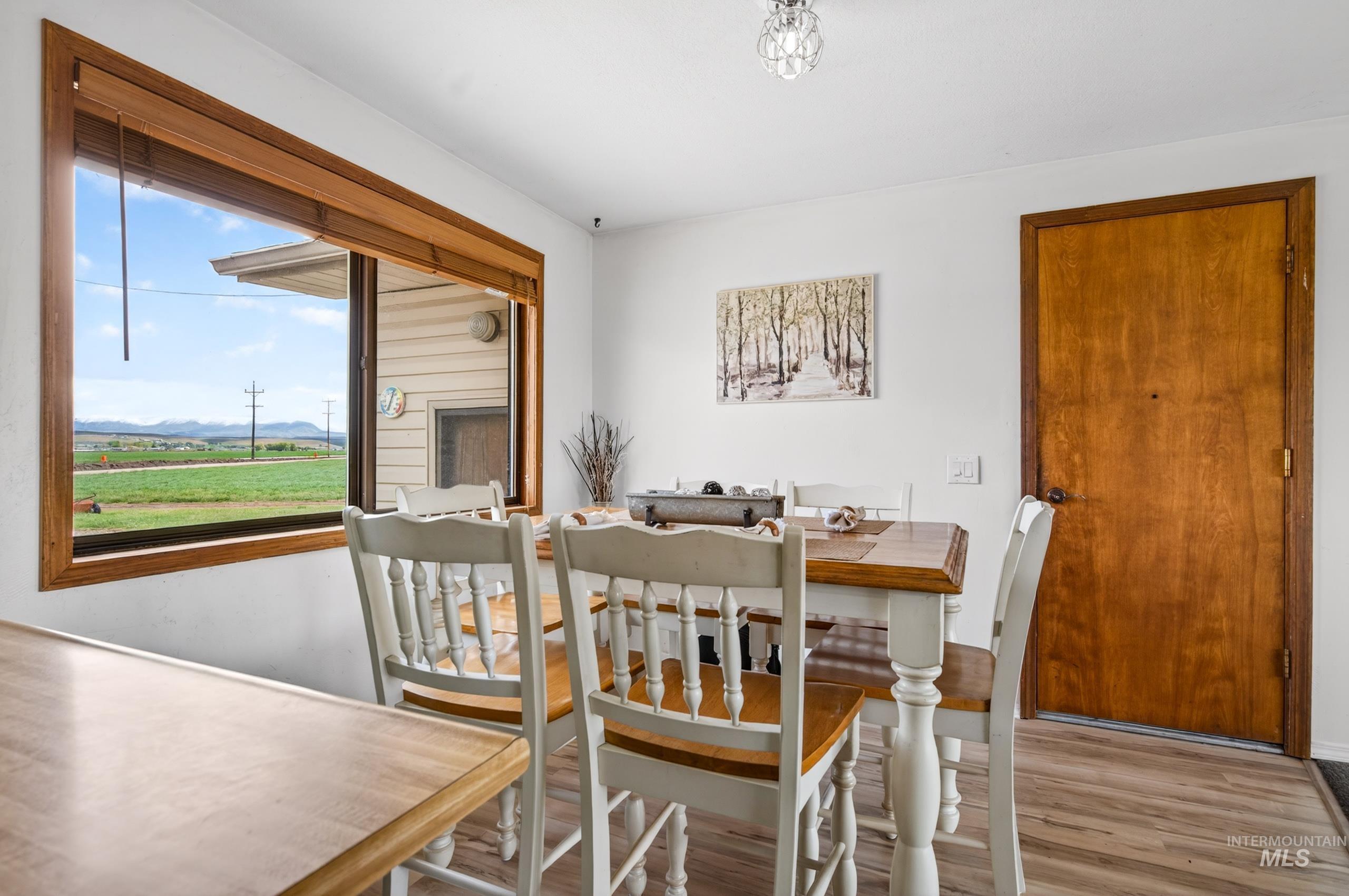 8989 Hillview Road Emmett, ID 83617 - Photo 13 of 50 Dining space with wood finished floors and a mountain view