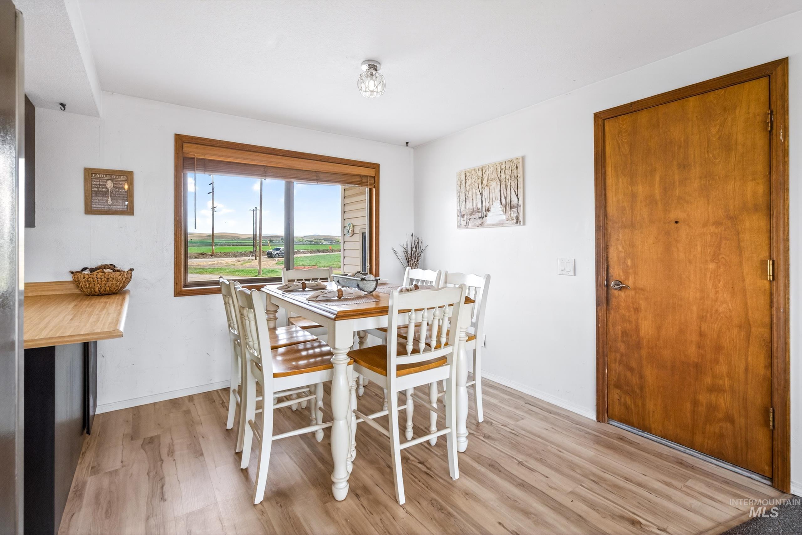 8989 Hillview Road Emmett, ID 83617 - Photo 14 of 50 Dining space featuring light wood finished floors