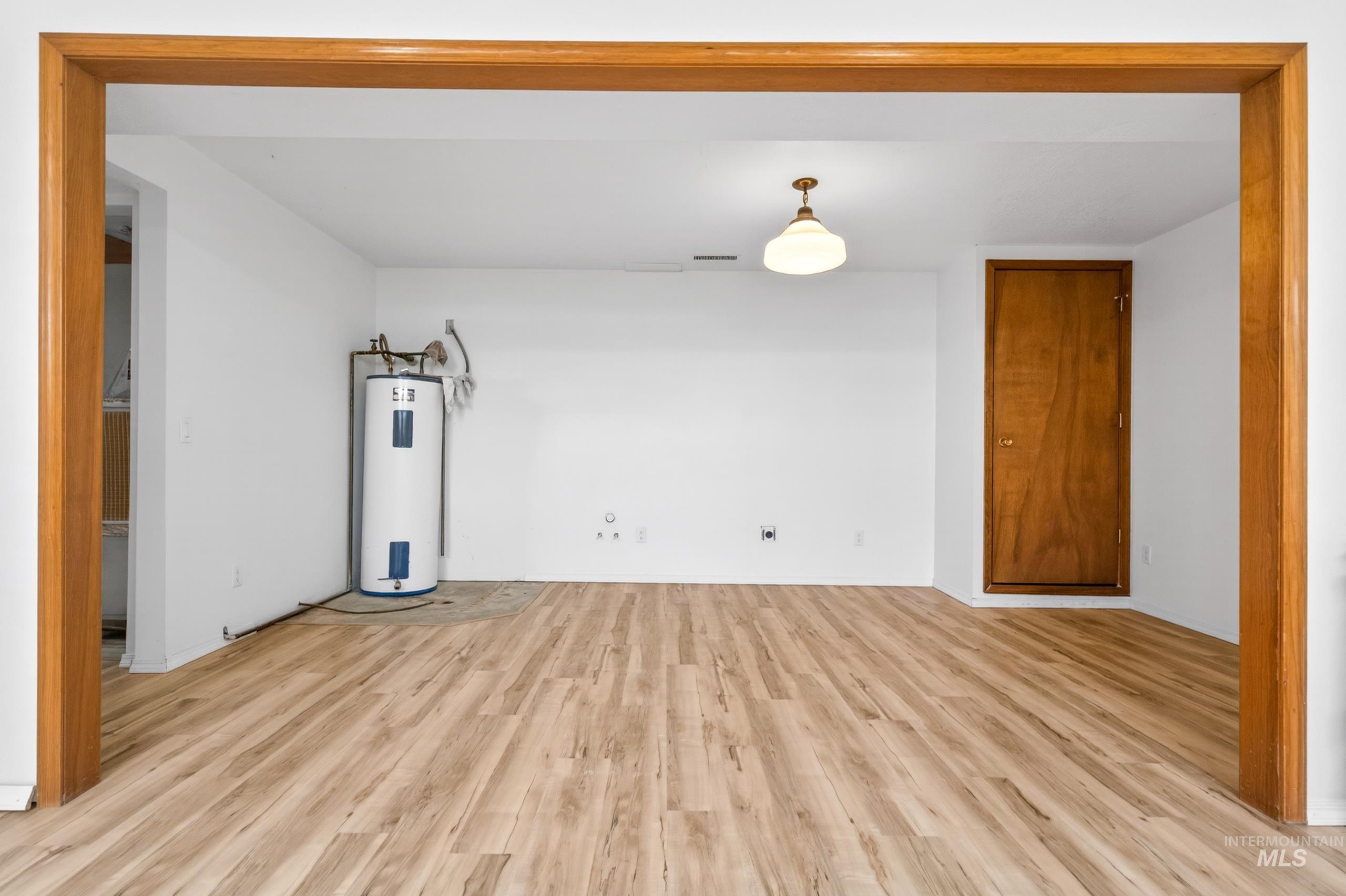 8989 Hillview Road Emmett, ID 83617 - Photo 38 of 50 Unfurnished room with light wood-type flooring and electric water heater